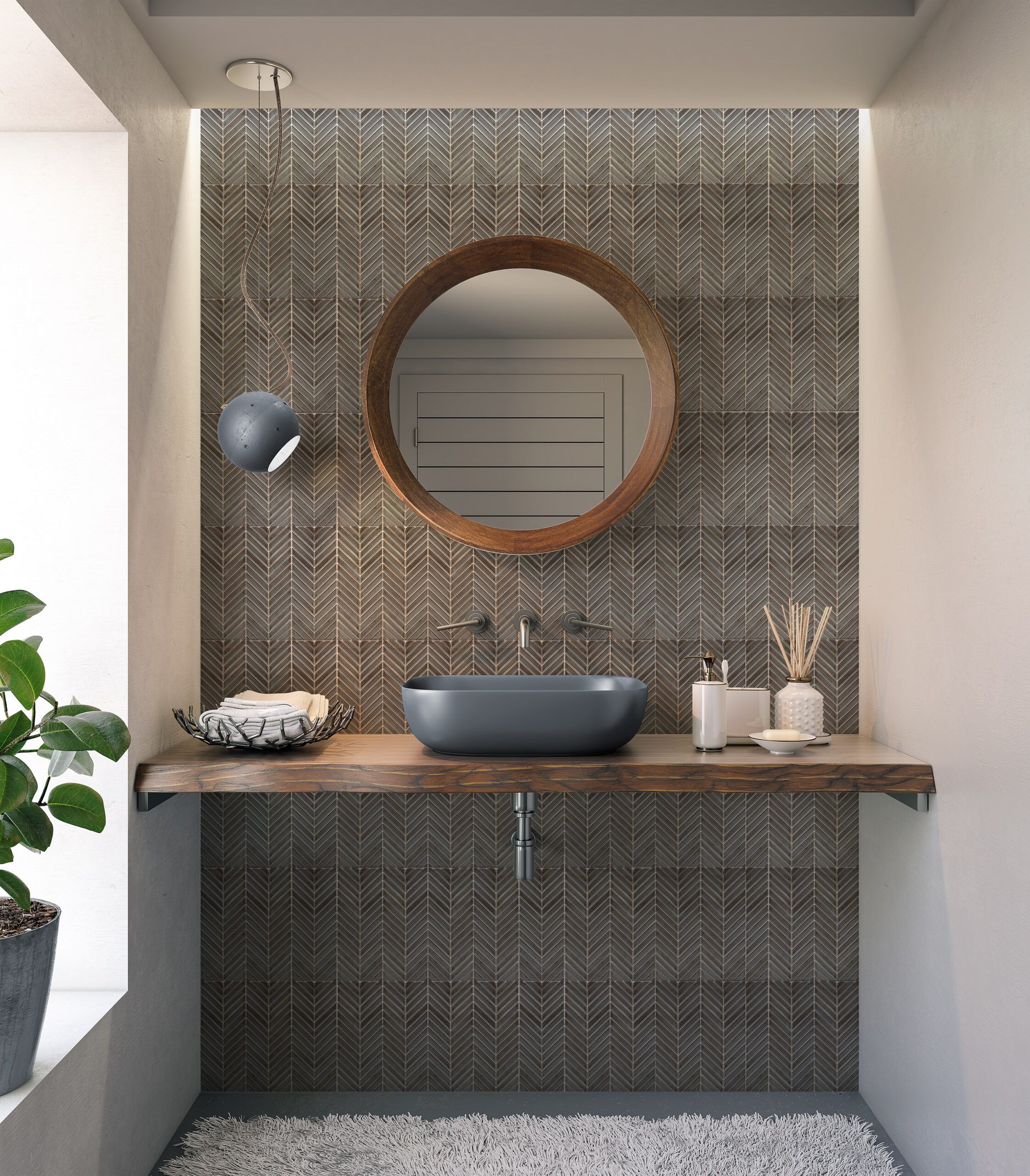<img src=“Herinbon-mockup-Lumin-Bath-Full-wall-lr-scaled.jpg” alt=“Bathroom sink with faucet and circular mirror, Lumin mosaic tile on wall”/>